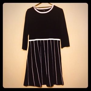Black sweater dress with vertical striped skirt